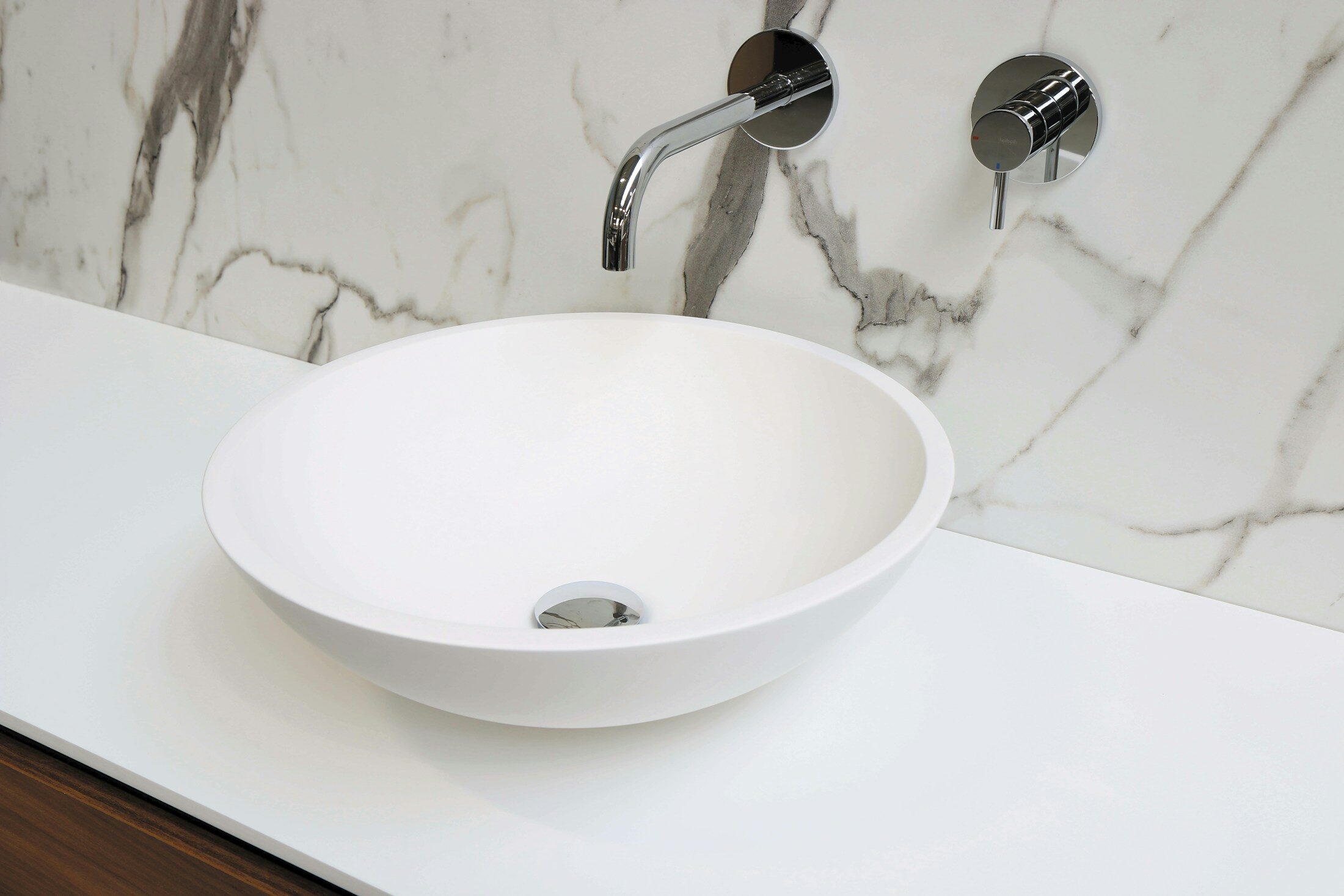 Photo by Sanibell BV stainless steel faucet on white ceramic sink